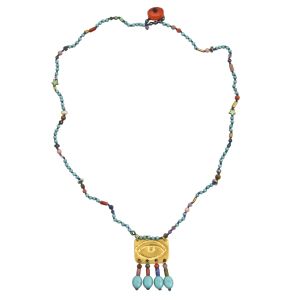 Colorful Rosario necklace with hand-carved rectangular evil eye pendant and a random mix of turquoise and semi-precious stones.